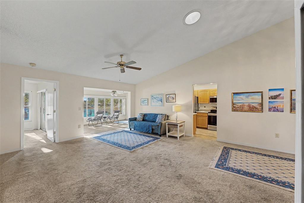 7406 Heather Walk Drive Weeki Wachee, FL 34613 - Photo 23 of 49 a living room with furniture and a window