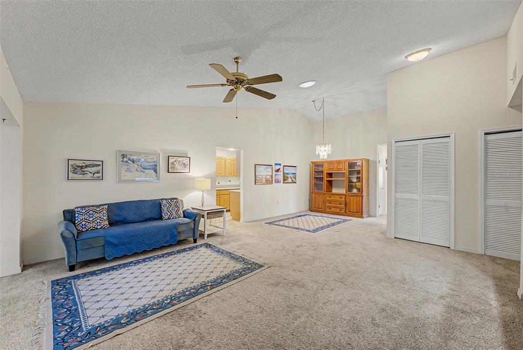 7406 Heather Walk Drive Weeki Wachee, FL 34613 - Photo 24 of 49 a living room with furniture and a ceiling fan