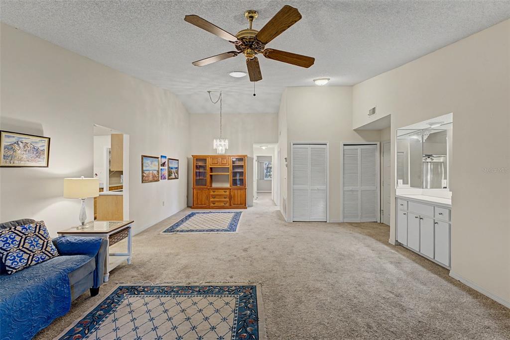 7406 Heather Walk Drive Weeki Wachee, FL 34613 - Photo 25 of 49 a living room with furniture and a rug