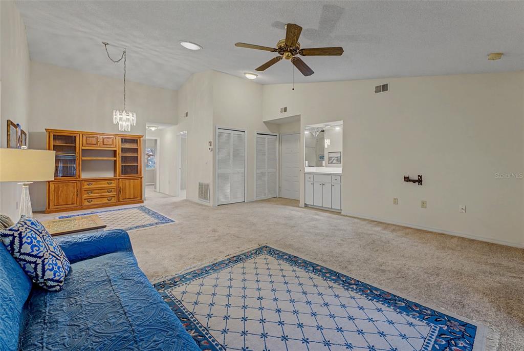 7406 Heather Walk Drive Weeki Wachee, FL 34613 - Photo 26 of 49 a very nice looking room with a ceiling fan