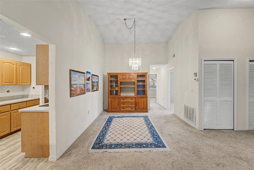 7406 Heather Walk Drive Weeki Wachee, FL 34613 - Photo 27 of 49 a view of a hallway view with wooden floor and staircase