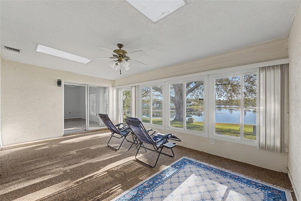 7406 Heather Walk Drive Weeki Wachee, FL 34613 - Photo 40 of 49 a living room with furniture and a window