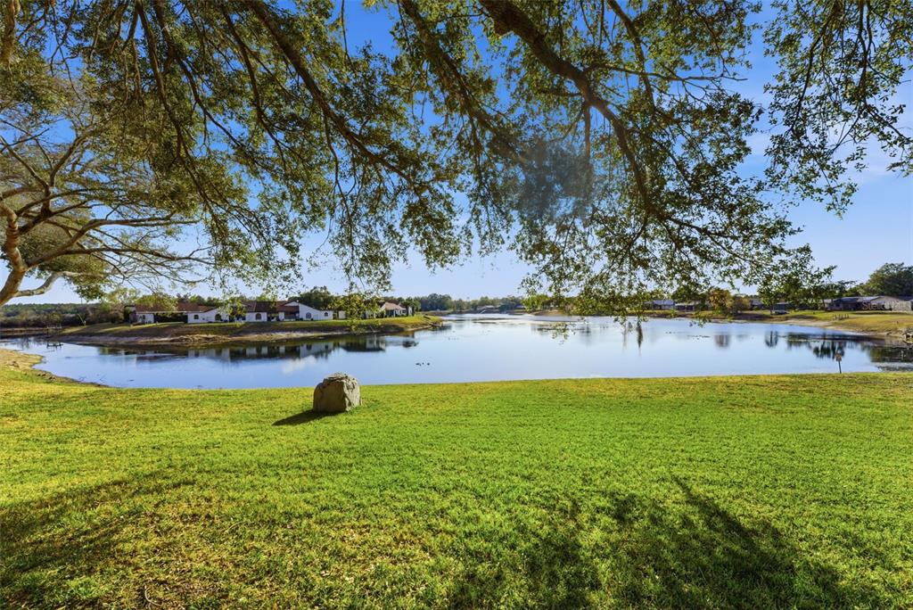 7406 Heather Walk Drive Weeki Wachee, FL 34613 - Photo 4 of 49 a view of a lake with outdoor space