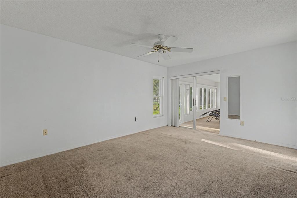 7406 Heather Walk Drive Weeki Wachee, FL 34613 - Photo 44 of 49 a view of an empty room with a window