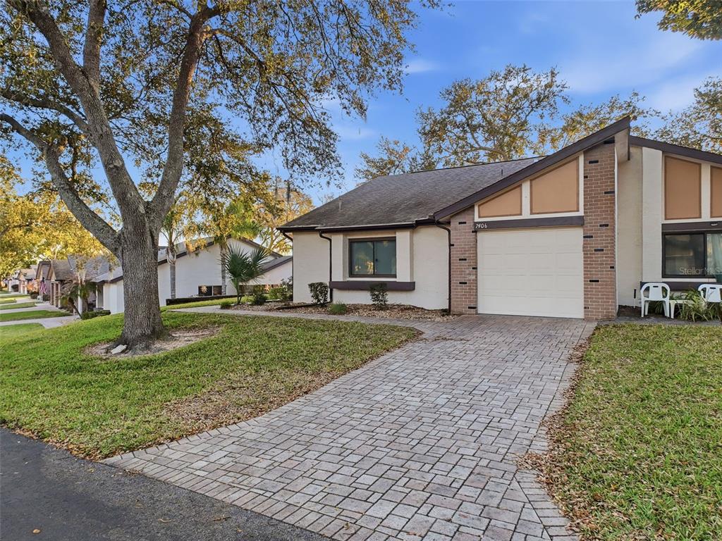 7406 Heather Walk Drive Weeki Wachee, FL 34613 - Photo 10 of 49 a view of a house with a yard