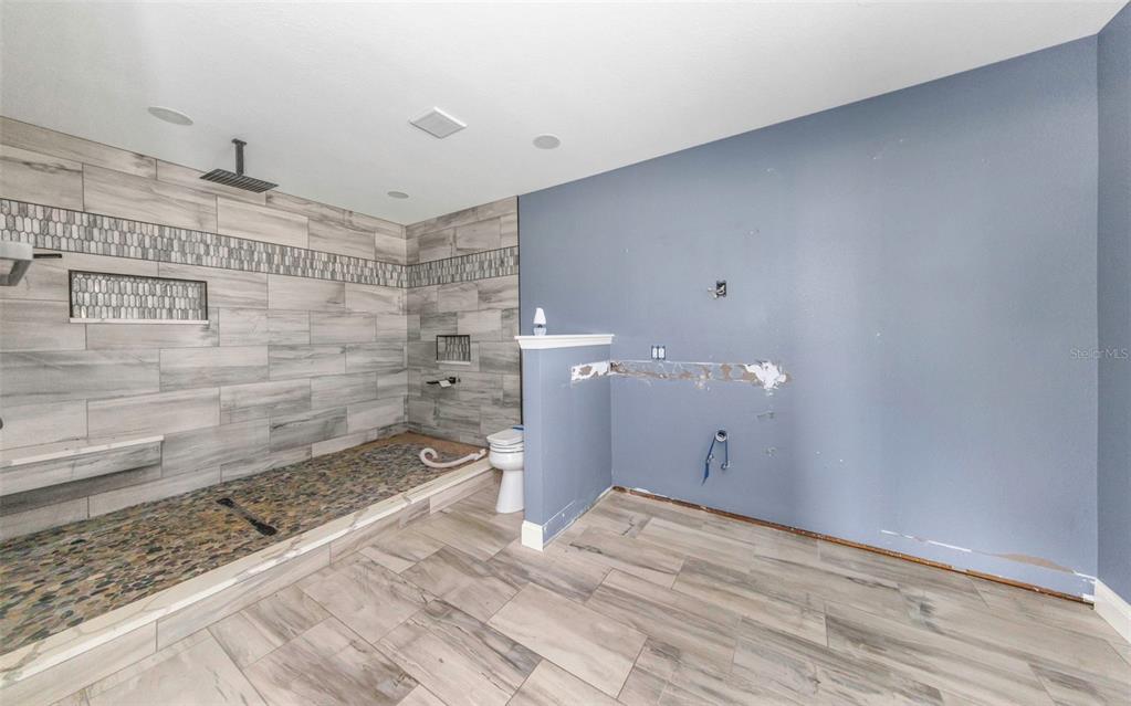 20138 Bowman Road Spring Hill, FL 34610 - Photo 28 of 40 a bathroom with a sink shower and a mirror