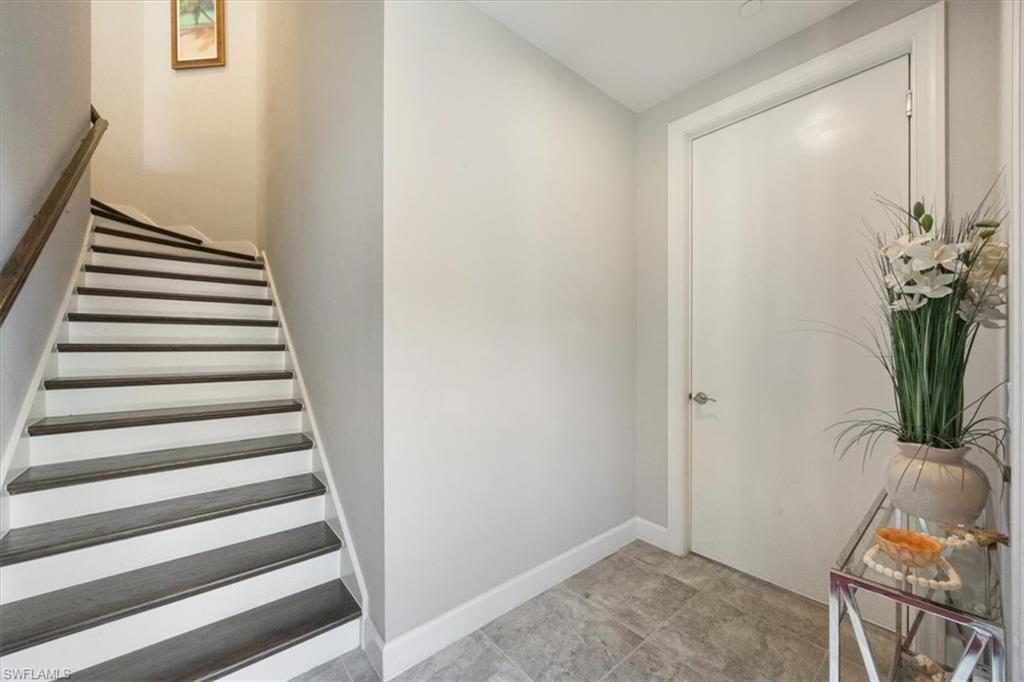 8773 Bellano Court, Unit 201 Naples, FL 34119 - Photo 22 of 34 a view of entryway with wooden floor