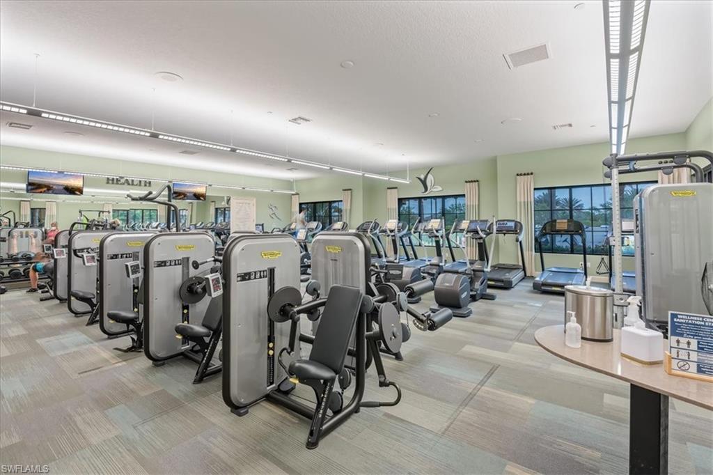 8773 Bellano Court, Unit 201 Naples, FL 34119 - Photo 32 of 34 a view of a room with gym equipment