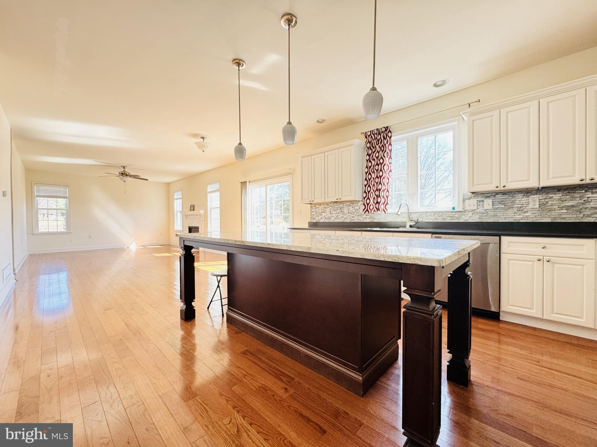 20 Lippitt Road Honey Brook, PA 19344 - Photo 14 of 38 a kitchen with stainless steel appliances granite countertop a sink a stove and a wooden floors