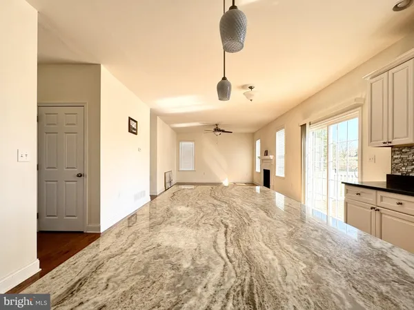 a large bedroom with a bed and a chandelier