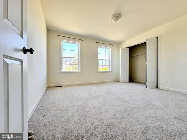 an empty room with windows