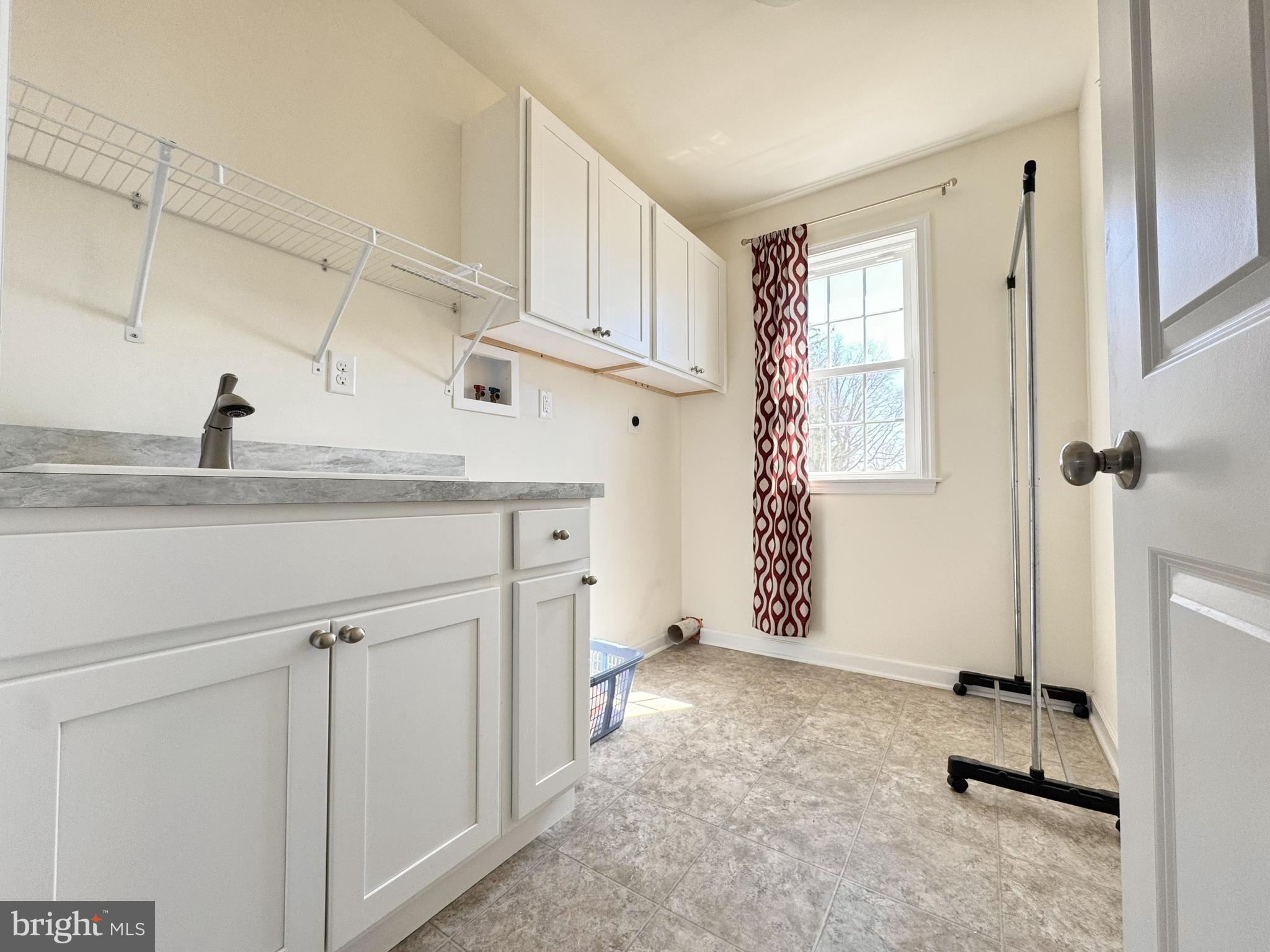 20 Lippitt Road Honey Brook, PA 19344 - Photo 31 of 38 a kitchen with a sink cabinets and appliances