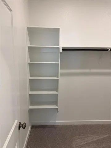 a view of an empty walk in closet