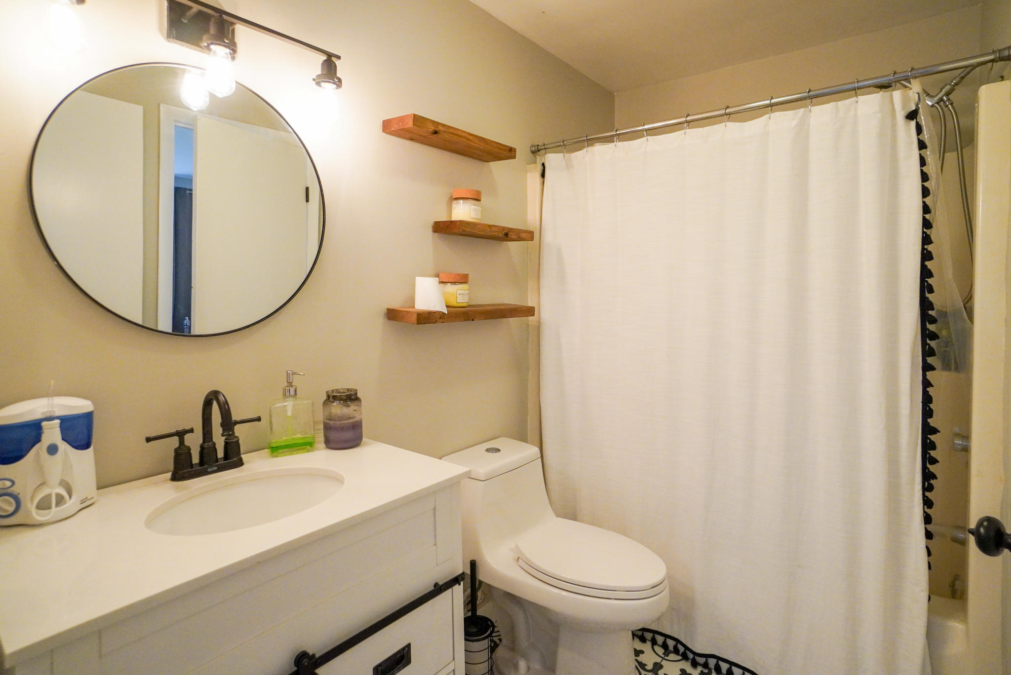 92 Springhill Road Vineyard Haven, MA 02568 - Photo 33 of 38 a bathroom with a sink a toilet and a mirror