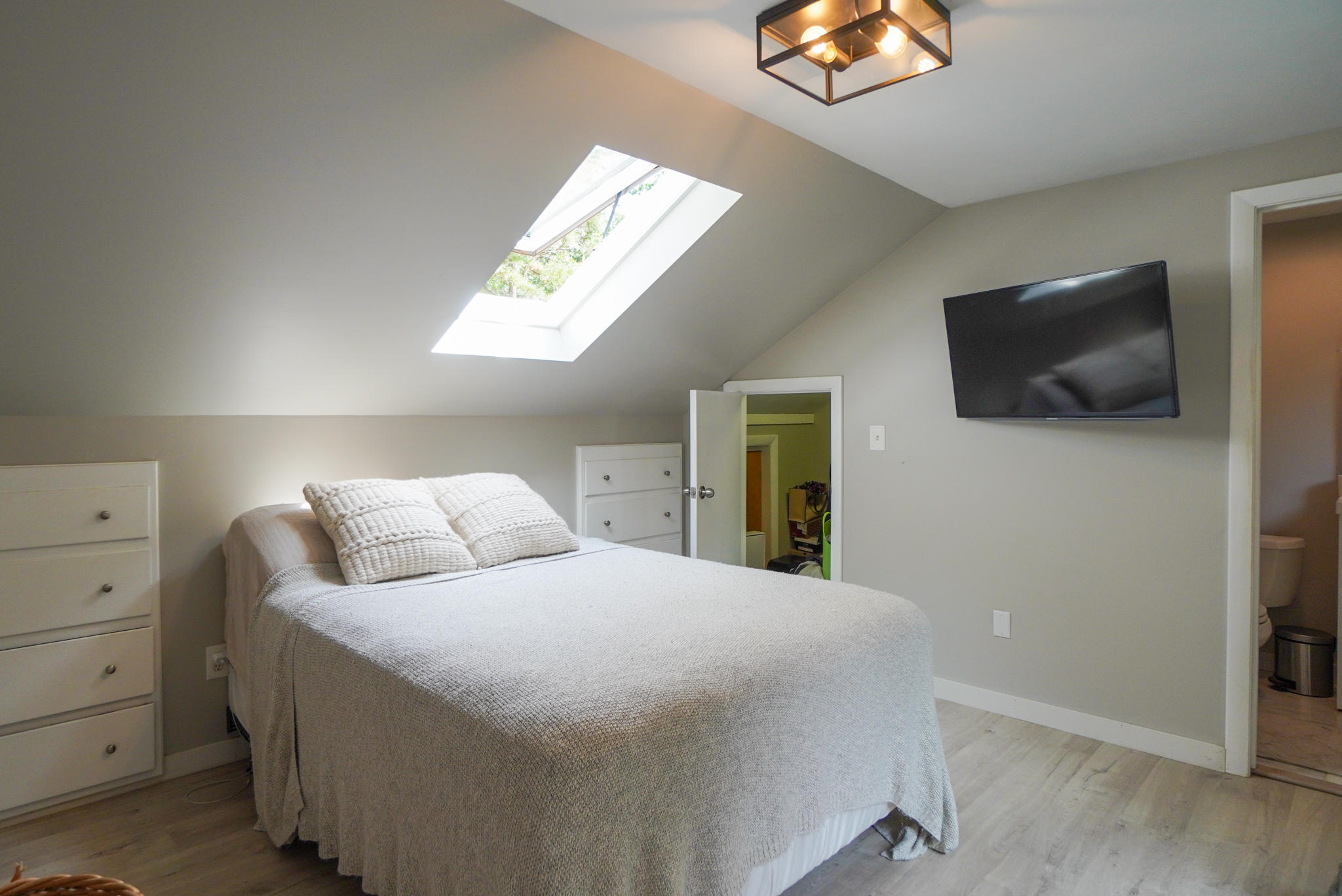 92 Springhill Road Vineyard Haven, MA 02568 - Photo 34 of 38 a bedroom with a bed and a flat screen tv