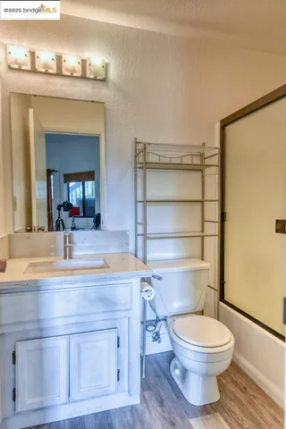 a view of a balcony with wooden floor and outdoor seating