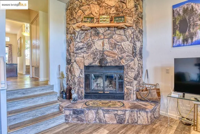 a kitchen with granite countertop white cabinets and stainless steel appliances