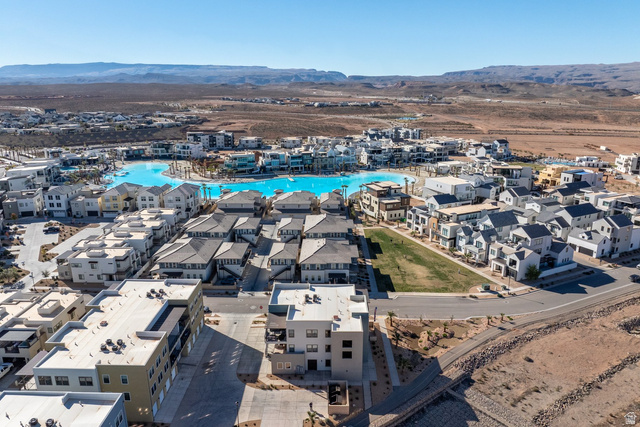 762 West Periwinkle Lane, Unit 102 St. George, UT 84790 - Photo 32 of 40 Aerial view of property's location featuring a mountain backdrop and nearby suburban area
