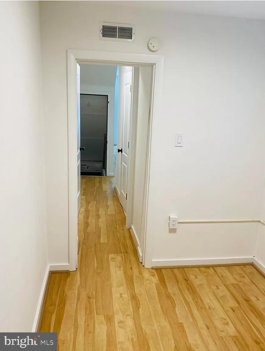 407 South 20th Street, Unit A Philadelphia, PA 19146 - Photo 11 of 14 a view of a room with wooden floor