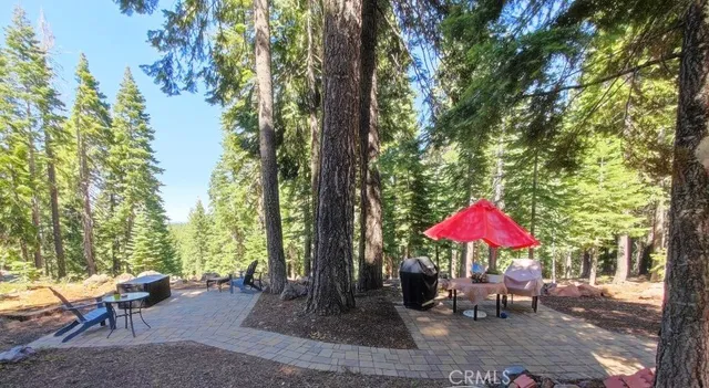 an outdoor space with furniture and umbrella