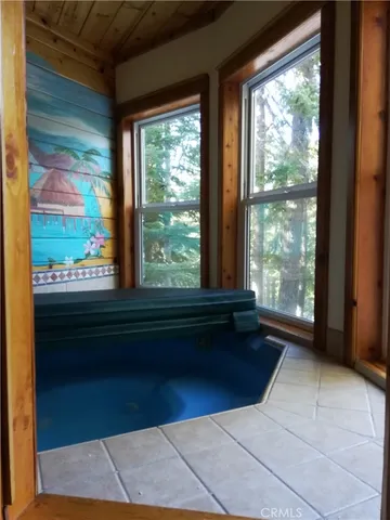 a room with a large window and view of balcony