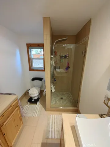 a bathroom with a bathtub and a shower