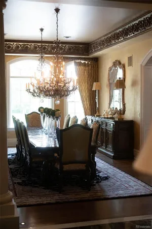 a view of a dining room with furniture and window