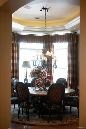a view of a dining room with furniture and window