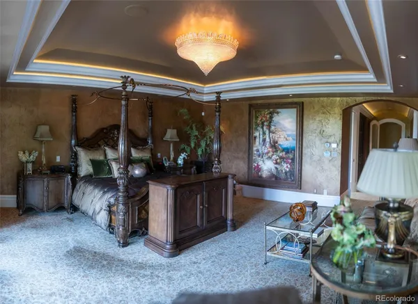 a view of living room with furniture and chandelier