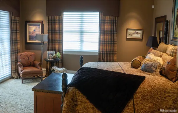 a bedroom with a bed and a couch
