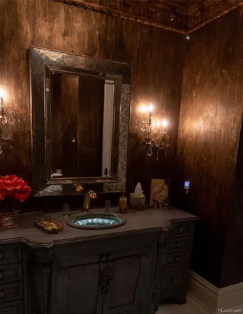 a bathroom with a sink vanity and a mirror