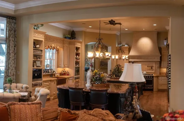 a room with lots of furniture and lamp