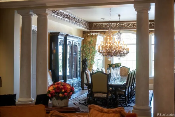 a view of a dining room with furniture and window
