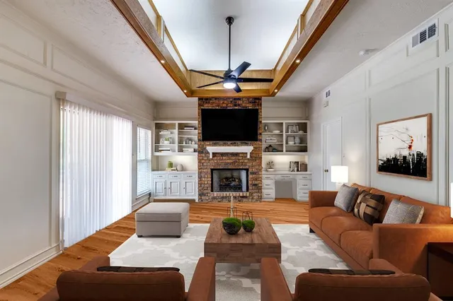 a living room with fireplace furniture and a flat screen tv