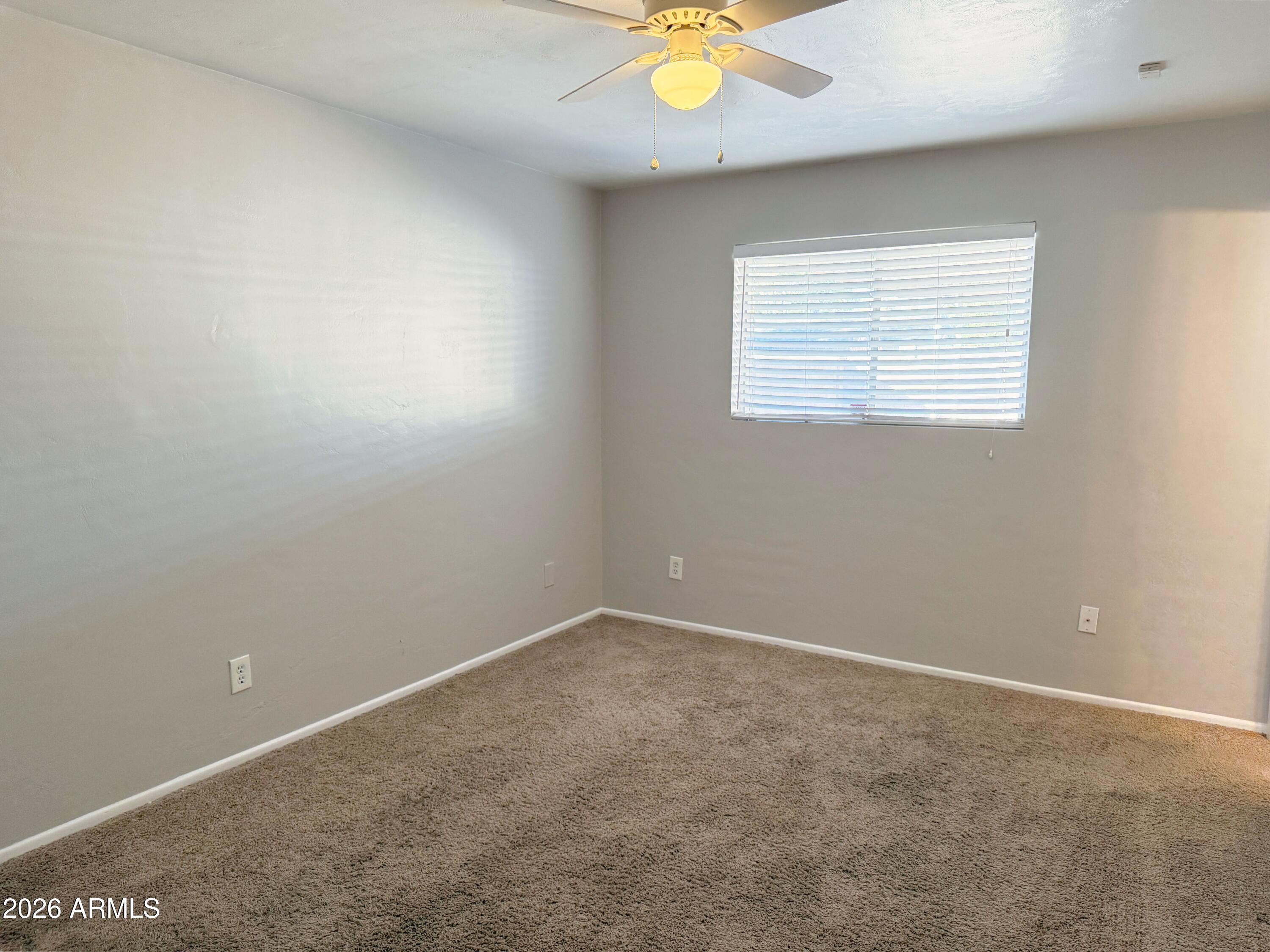 1220 West Romo Jones Street Tempe, AZ 85281 - Photo 19 of 26 an empty room with a window