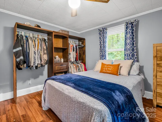 a bedroom with a bed and a walk in closet