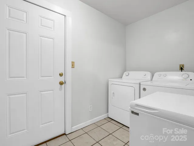 a view of storage and utility room with washer and dryer