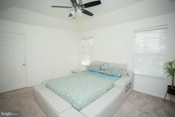 a bedroom with a bed and furniture