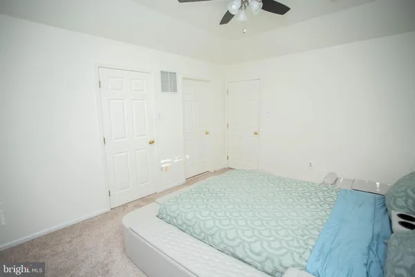 an empty room with a rug