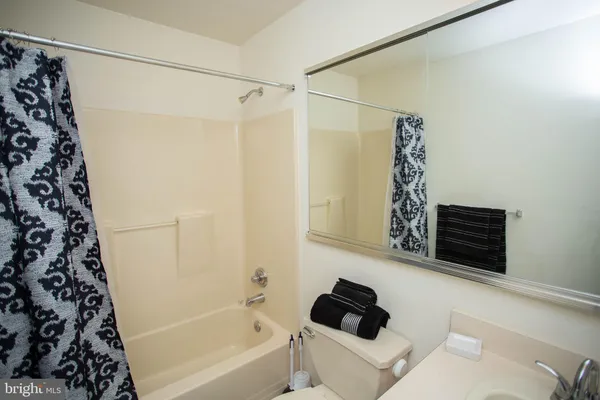 a bathroom with a bathtub and shower