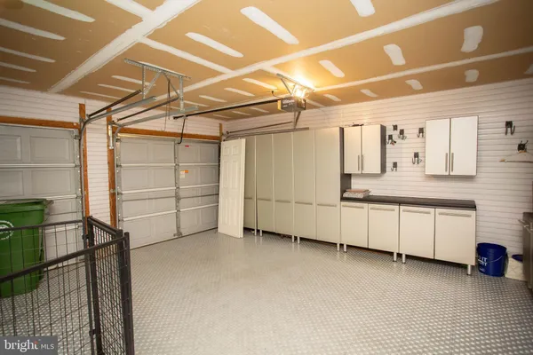 a view of a utility room with racks on the wall