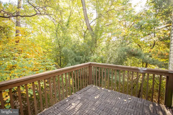 a view of balcony with wooden floor