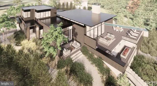 a view of a house with roof deck and furniture