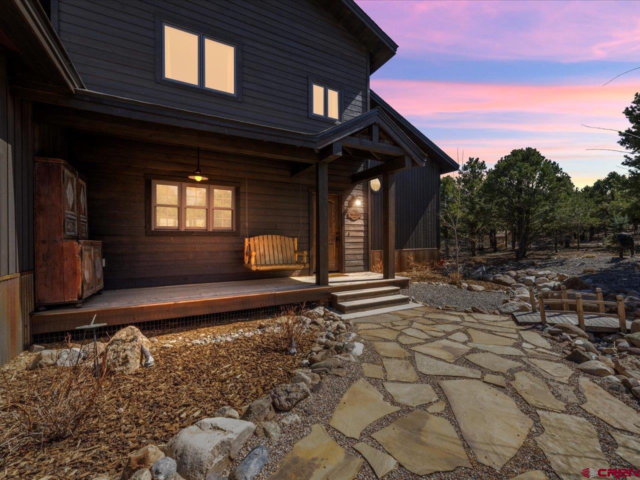 810 Pine Drive Ridgway, CO 81432 - Photo 1 of 36 a front view of a house with a yard