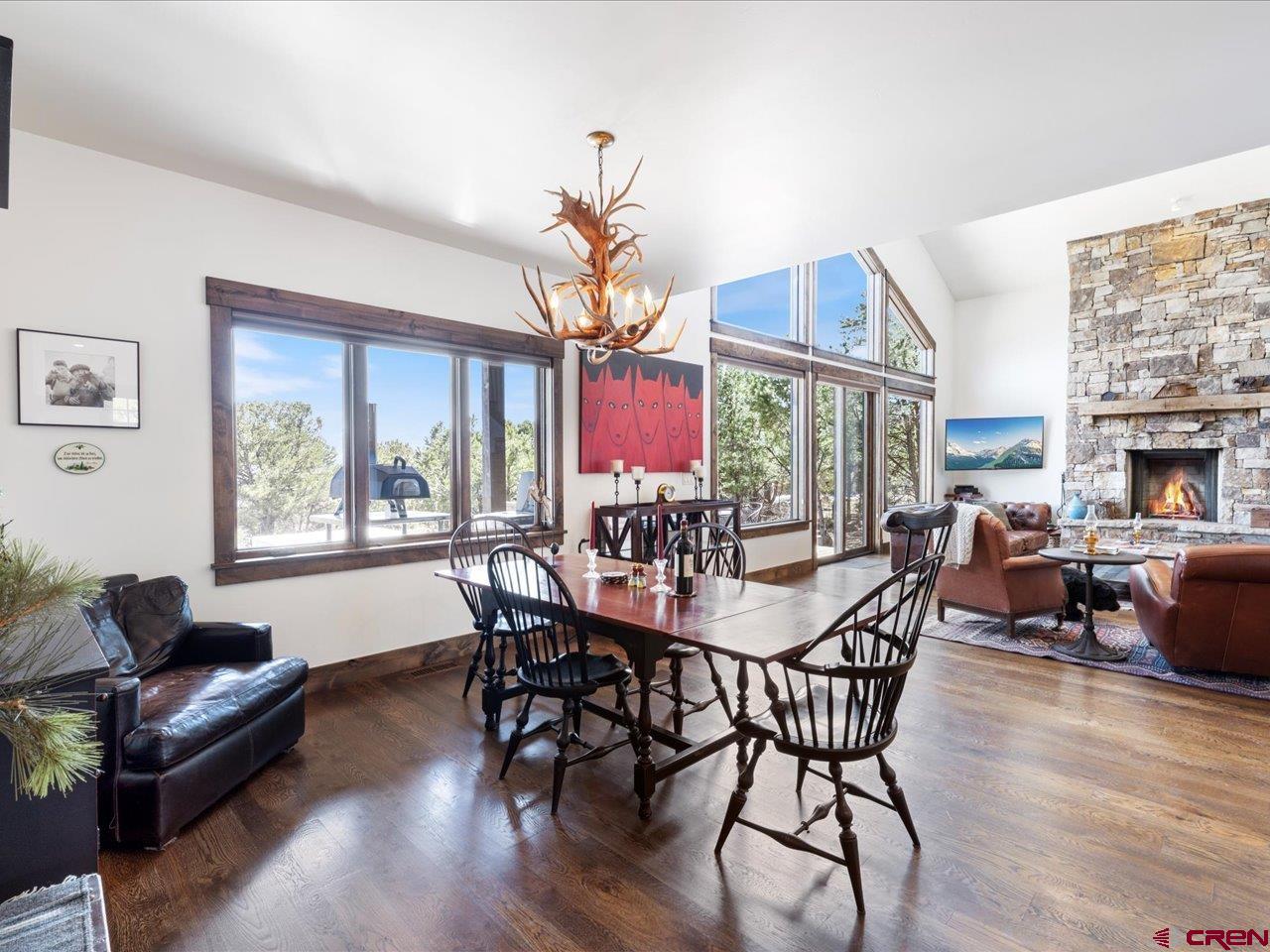 810 Pine Drive Ridgway, CO 81432 - Photo 11 of 36 a view of a dining room with furniture window and wooden floor