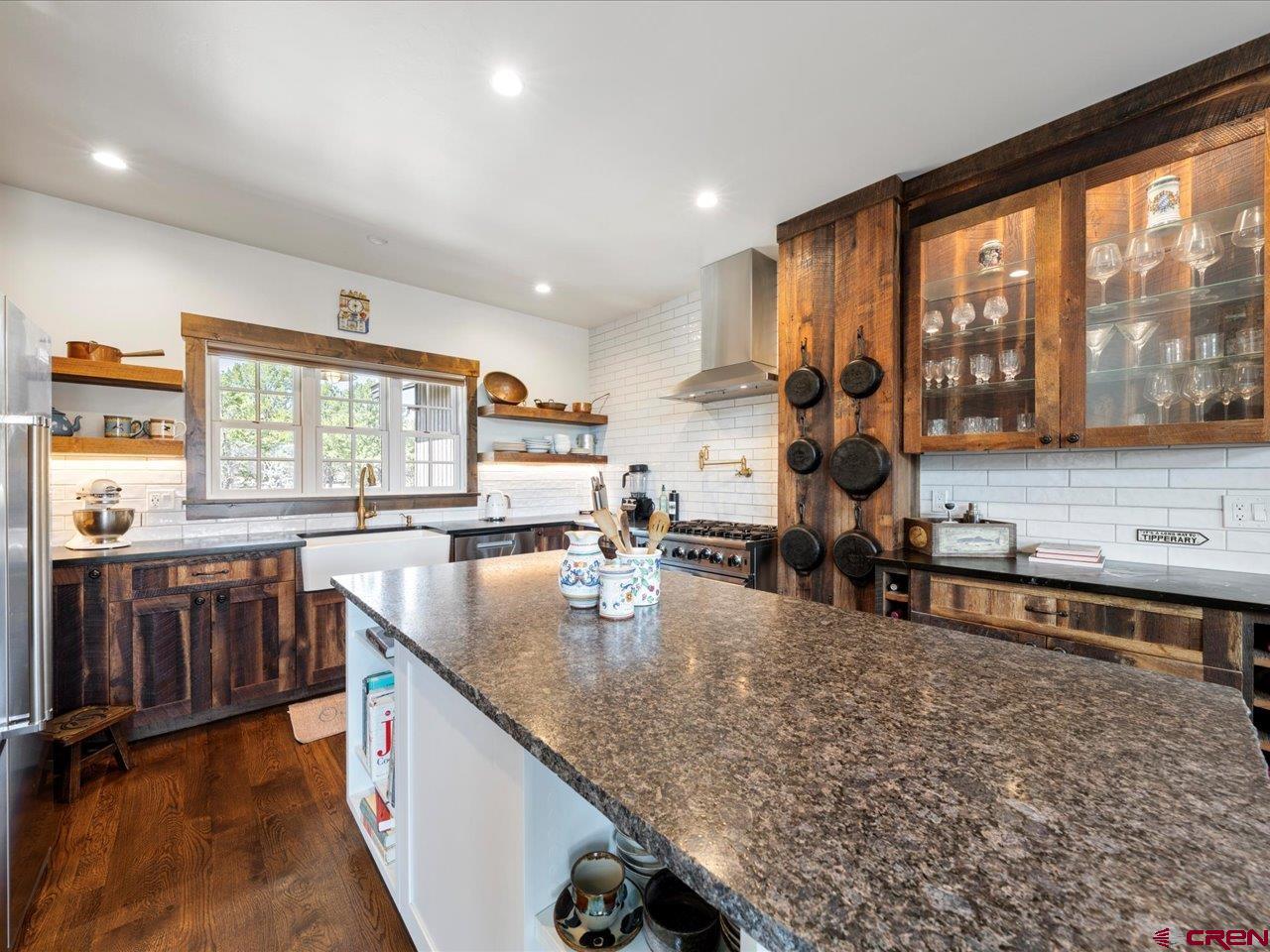 810 Pine Drive Ridgway, CO 81432 - Photo 13 of 36 a kitchen with counter top space and windows