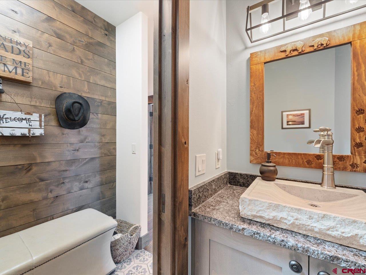 810 Pine Drive Ridgway, CO 81432 - Photo 17 of 36 a bathroom with a granite countertop sink a toilet and shower