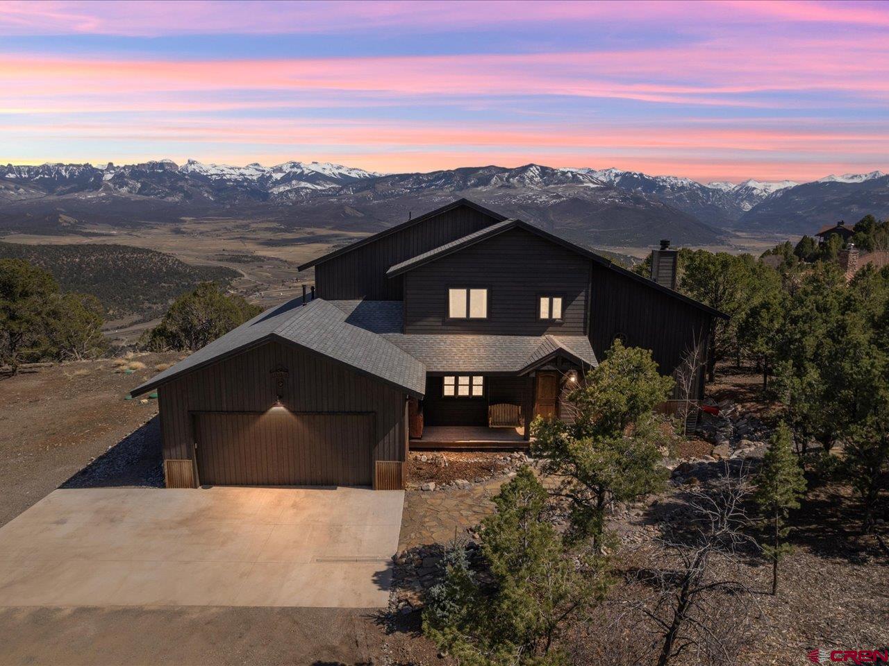 810 Pine Drive Ridgway, CO 81432 - Photo 2 of 36 a front view of a house with a yard