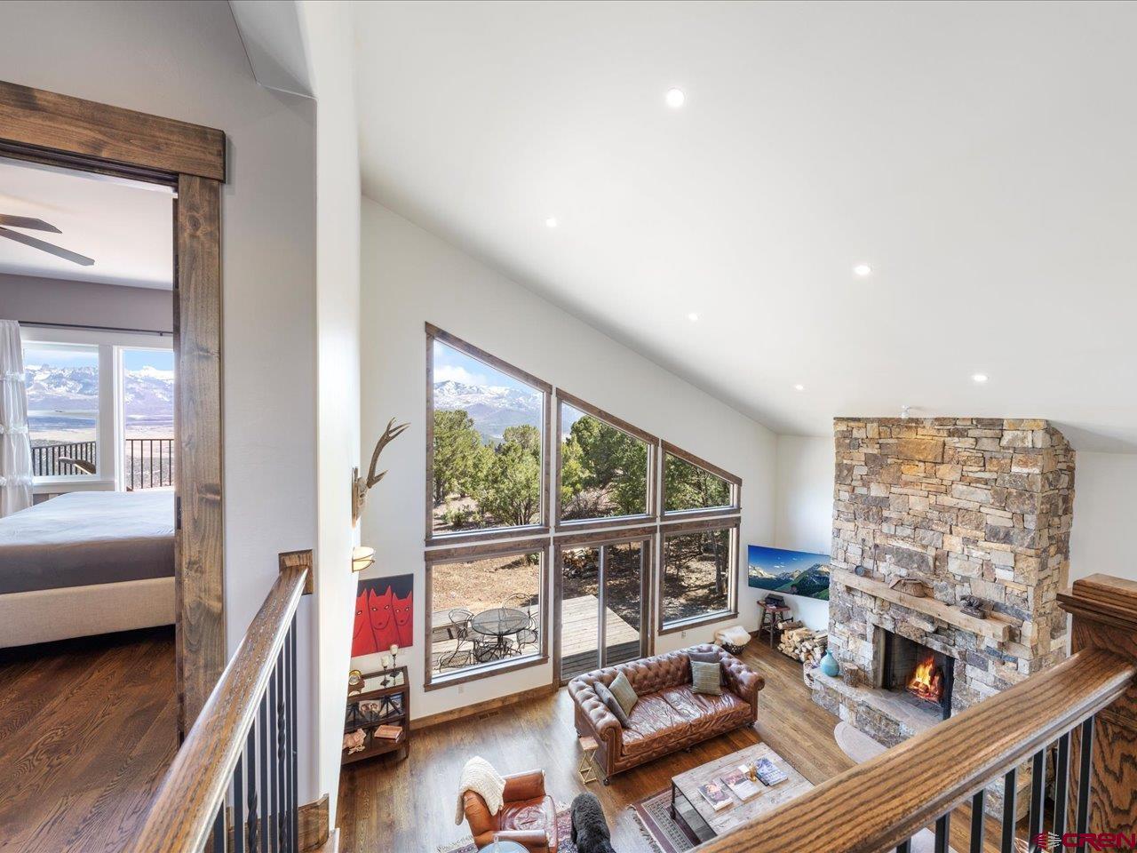 810 Pine Drive Ridgway, CO 81432 - Photo 23 of 36 a living room with furniture and a floor to ceiling window