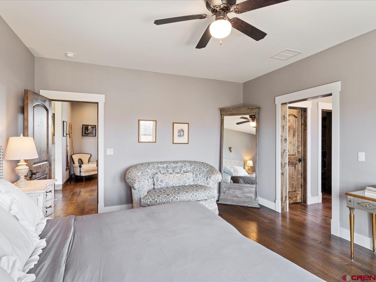 810 Pine Drive Ridgway, CO 81432 - Photo 26 of 36 a bedroom with a bed and wooden floor